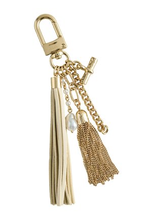 Gold keychain with cream leather tassel, gold chain tassel, faux pearls, and a toggle clasp.