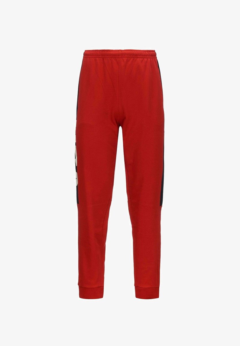 Pantalon de jogging rouge avec taille élastique, jambes fuselées et panneaux latéraux noirs avec accents de texte blancs.