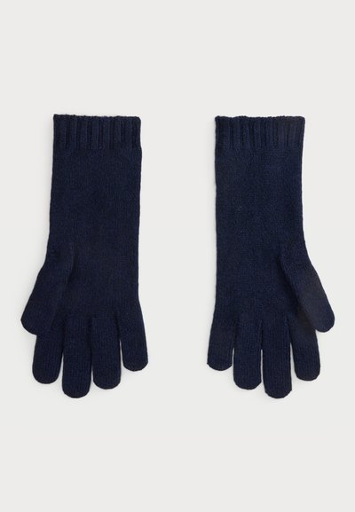 Guanti lavorati a maglia di colore blu navy con polsini a costine, dotati di dita separate e una finitura morbida e testurizzata. Realizzati in tessuto caldo adatto per il clima freddo.