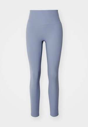 High-waisted leggings in soft, stretchable fabric. Solid light blue color, with a smooth texture and fitted design. No visible seams or patterns.