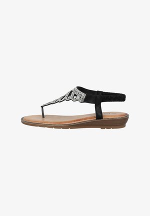 Schwarze Zehentrenner-Sandale mit verzierten Riemen, die silberfarbene Akzente aufweisen und eine gepolsterte braune Innensohle besitzen. Die flexible Gummisohle sorgt für Komfort.