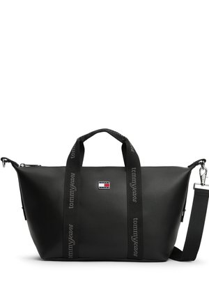 Czarna torba Tommy Jeans typu duffel z podwójnymi uchwytami i odpinanym paskiem na ramię, z naszywką z logo z przodu.