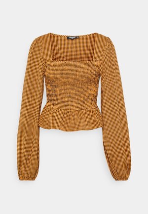 Bluse mit gelb-schwarz karriertem Muster, langen Ärmeln, quadratischem Ausschnitt und gerafftem Oberteil, das zu einem Peplum-Saum übergeht.