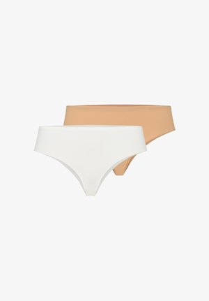 Kaksi saumattomien naisten bikini-tyyppistä alusvaatetta valkoisena ja beigenä, esitettynä tasaisena valkoisella taustalla.