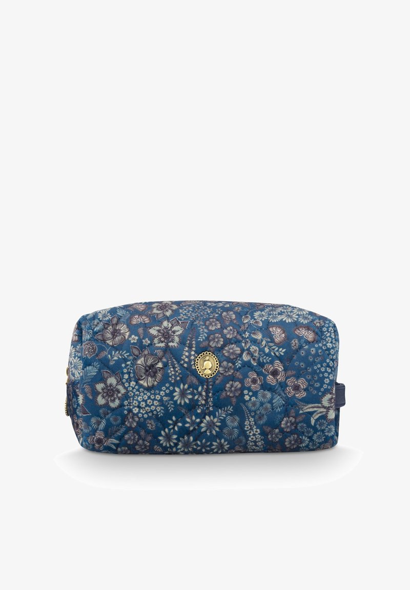Quilted cosmetic bag in dark blue with floral pattern. Features gold hardware and a zip closure. Rectangular shape with a side handle.