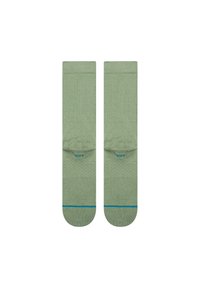 Sosete verzi cu o textură canelată, având un design solid și un accent albastru în contrast aproape de manșetă.