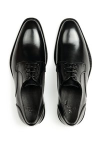 Schwarze Leder-Dressschuhe mit glänzender Oberfläche, ausgestattet mit einem Schnürdesign, runder Zehenform und strukturierten Innensohlen für Komfort.