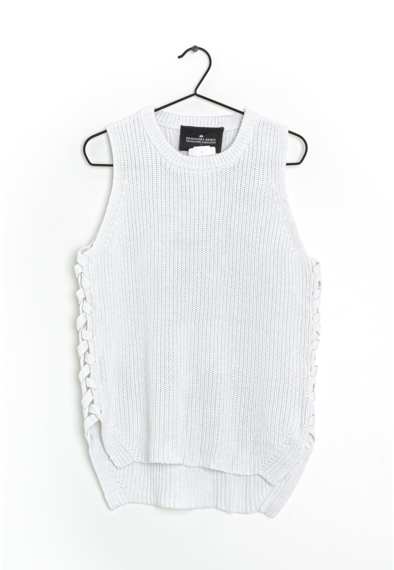 Top sin mangas de punto blanco con detalle de cordones laterales, escote redondo y un dobladillo ligeramente curvado. Fabricado con tela texturizada.