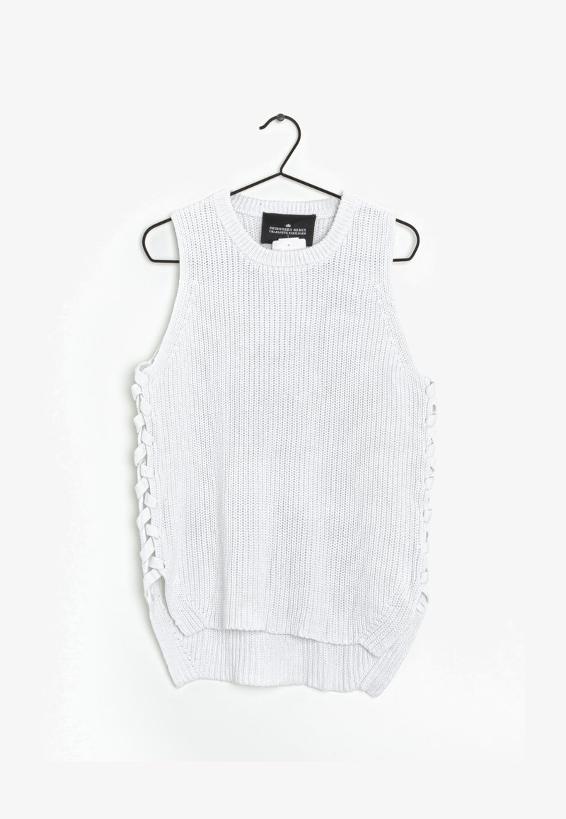 Haut sans manches en tricot blanc avec un lacet sur le côté, encolure ronde et ourlet légèrement incurvé. Fabriqué en tissu texturé.