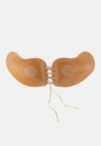 Pannelli per il seno in silicone nudo, uniti con una finitura lucida, dotati di un laccio centrale e velcro in satin per una vestibilità sicura.