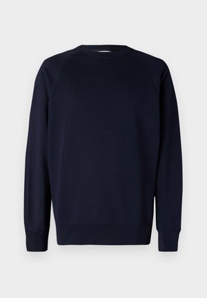 Mornarsko modra dolg rokav sweatshirt z raglan rokavi, okroglo izrezan vrt, ribana manšeta in rob. Gladek bombažni material, minimalističen dizajn.