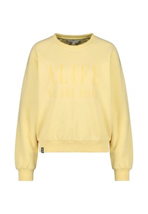 Hellgelbes Sweatshirt mit Rundhalsausschnitt, langen Ärmeln und gerippten Bündchen, mit schwach sichtbarem Text "ALIFE WE ARE ALIFE" auf der Vorderseite.