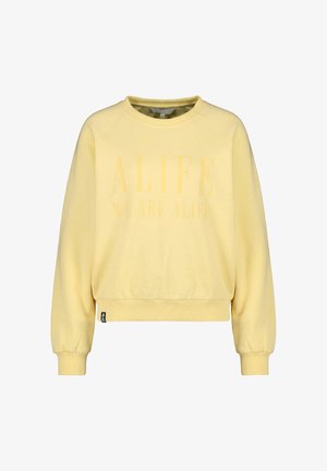 Hellgelbes Sweatshirt mit Rundhalsausschnitt, langen Ärmeln und gerippten Bündchen, mit schwach sichtbarem Text "ALIFE WE ARE ALIFE" auf der Vorderseite.
