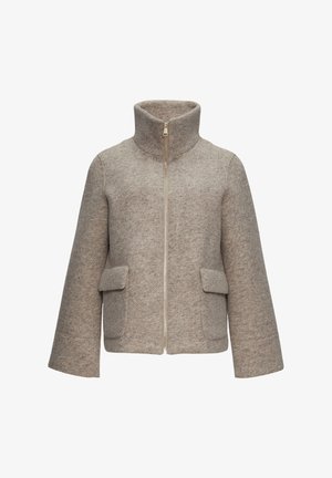 Beige wollen mix jas met hoge kraag, front rits, twee opgestikte zakken en brede mouwen. Textuurstof met een subtiel patroon.