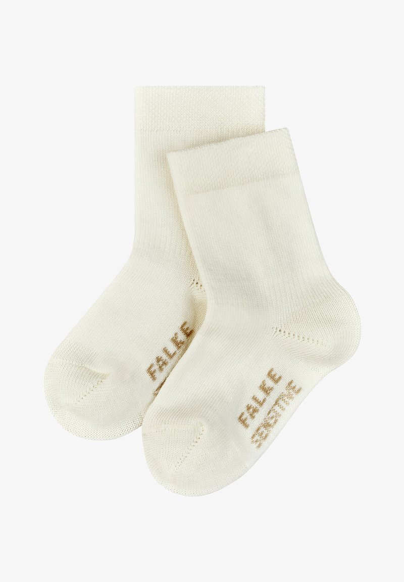 Cremfarbene Baumwollsocken mit glatter Textur. Sie besitzen einen gerippten Bund und die Aufschrift "FALKE SENSITIVE" in Hellbraun an der Seite.