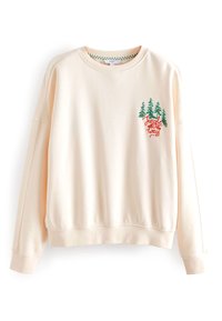 Sweatshirt pêche clair à manches longues, ornée d'arbres verts brodés et du texte rouge « Jungle All The Way » sur la poitrine. Tissu doux.