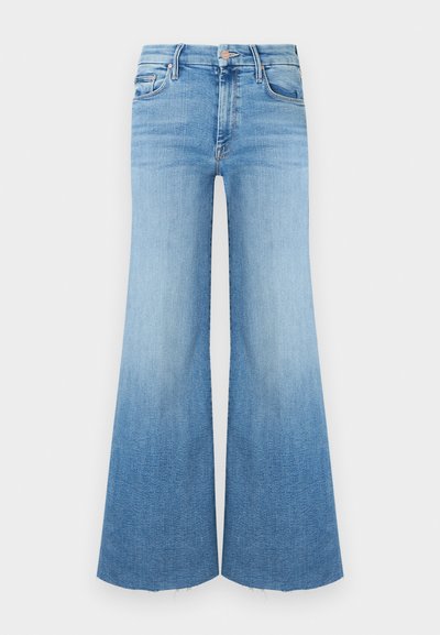 Light-wash denim jeans with a flared shape, featuring a high waist, two front pockets, and a raw hem at the bottom.