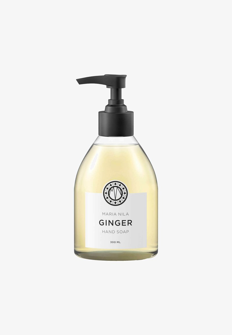 Heldere plastic pomp fles met lichtgele vloeistof gelabeld Maria Nila Ginger Handzeep, 300 ml.