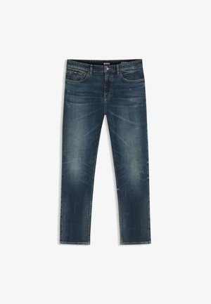 Jean en denim bleu foncé délavé avec poches avant, fermeture par boutons, passants pour ceinture et détails subtilement usés.