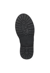 Black rubber shoe sole featuring a textured tread pattern with grooves and shapes for grip. Includes a circular logo and size marker.