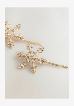 Gold snowflake hairpin featuring intricate leaf designs adorned with clear rhinestones, with a smooth texture and shiny finish.