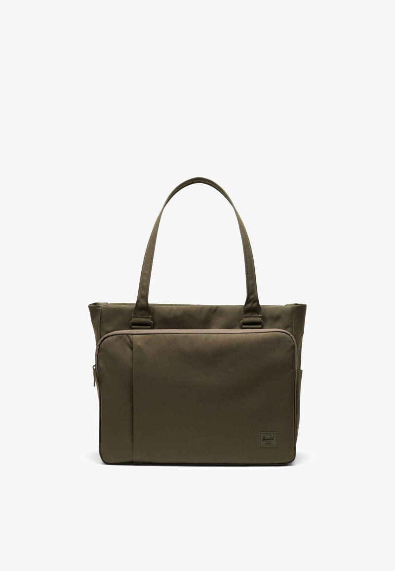 Sac fourre-tout vert olive en tissu durable, doté d'une poche zippée à l'avant, de deux anses et d'un écusson logo dans le coin inférieur droit.