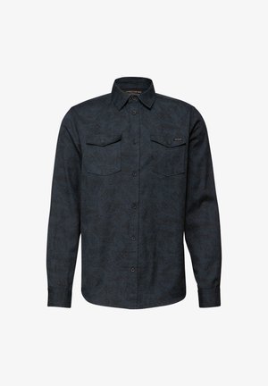 Tmavě modrá košile s dlouhým rukávem a texturovaným geometrickým vzorem, s límečkem na knoflíky, dvěma kapsami na hrudi a zapínáním na knoflíky.
