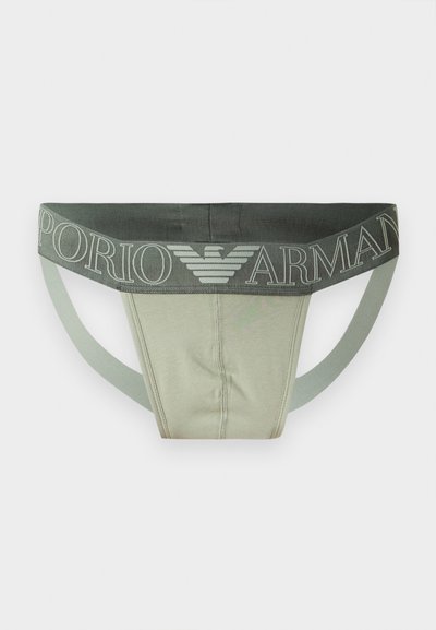Ανοιχτοπράσινο ανδρικό jockstrap με σκουροπράσινη ελαστική μέση με το κείμενο «Emporio Armani» και το λογότυπο αετού στο μπροστινό κέντρο.