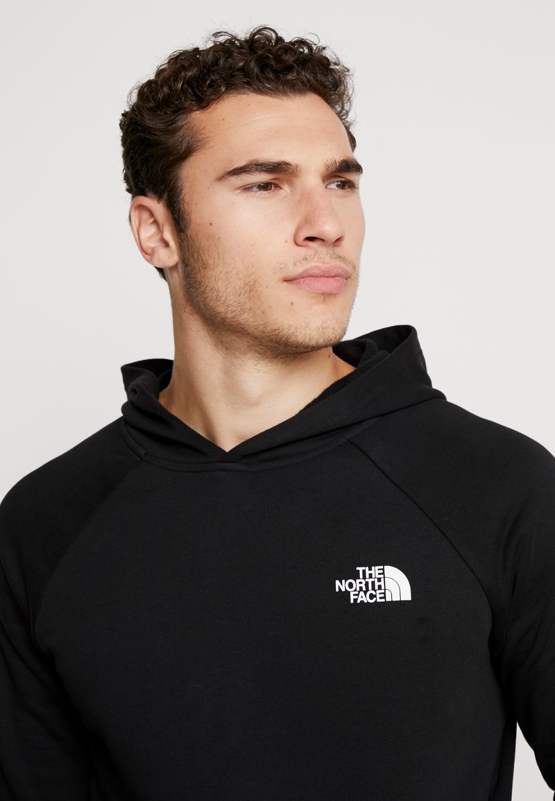 the north face raglan red box hoodie in black