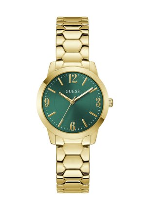 Orologio con bracciale a maglie color oro, quadrante verde, indici delle ore dorati e logo "GUESS" alle 12.