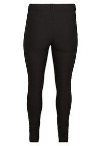 Schwarze Leggings aus dehnbarem Stoff, mit hohem Bund, glatter Textur und körpernahem Design ohne sichtbare Nähte.