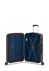 Hard-shell suitcase, black exterior, navy lining. Features red zippered pocket, adjustable straps, and height-adjustable handle with wheels.