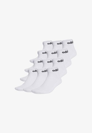 Hvide ankelstrømper i en pakke med ti, med sort "adidas" logo på kanten, lavet af et glat bomuldsblandingsmateriale.