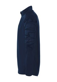 Veste zippée bleu marine avec un col haut. Présente des motifs géométriques texturés sur la manche droite. Fabriquée en matériau lisse et léger.