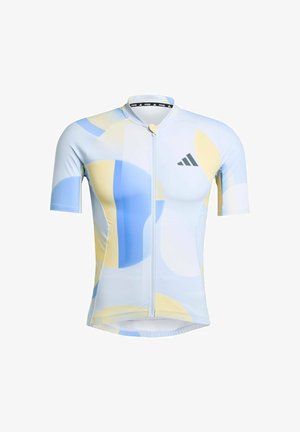 Maillot de cyclisme à manches courtes fabriqué en tissu léger et extensible. Présente un motif circulaire bleu, jaune et blanc avec une fermeture éclair sur le devant et le logo de la marque.