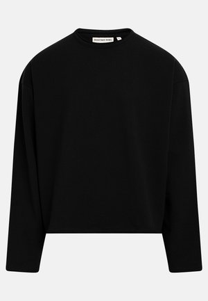 Μαύρο φούτερ με μακριά μανίκια και στρογγυλή λαιμόκοψη, με ίσια ραφή στο κάτω μέρος και ετικέτα "Redefined Rebel" στη λαιμόκοψη.