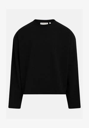 Μαύρο φούτερ με μακριά μανίκια και στρογγυλή λαιμόκοψη, με ίσια ραφή στο κάτω μέρος και ετικέτα "Redefined Rebel" στη λαιμόκοψη.