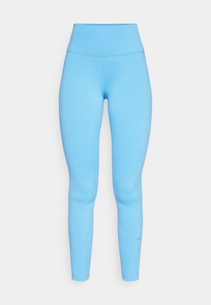 Blauwe high-waisted leggings gemaakt van rekbaar materiaal, met een gladde textuur en een aansluitend ontwerp. Subtiele Nike-logo nabij de enkel.