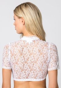 White lace crop top featuring short sleeves, floral patterns, and a scalloped edge. Sheer material provides a delicate appearance.