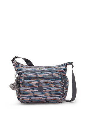 Crossbody bag with blue, orange, and white abstract stripes, multiple zippered pockets, adjustable strap, and a small grey teddy keychain.