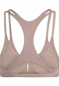 Sostén deportivo beige con diseño de espalda nadadora, hecho de una tela suave. Incluye tirantes ajustables y un corte en forma de llave en la parte posterior.