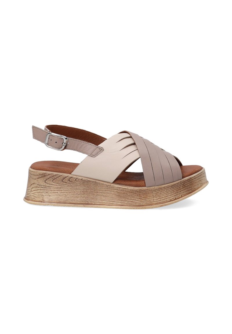 Beige leather sandal with a wide footbed, adjustable ankle strap, and a textured, platform sole featuring a wood-like pattern.
