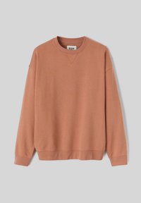Sweatshirt en mélange de coton de couleur pêche douce, avec un col rond, des poignets et un ourlet côtelés, offrant une coupe décontractée et une texture lisse.