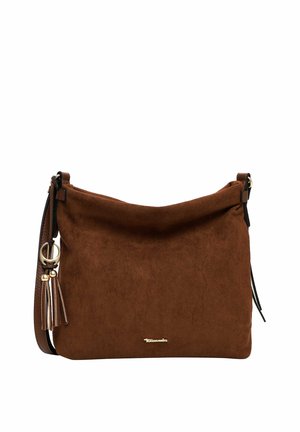 Sac à bandoulière en daim marron avec sangle ajustable, logo de marque doré et pompons décoratifs sur fond blanc.