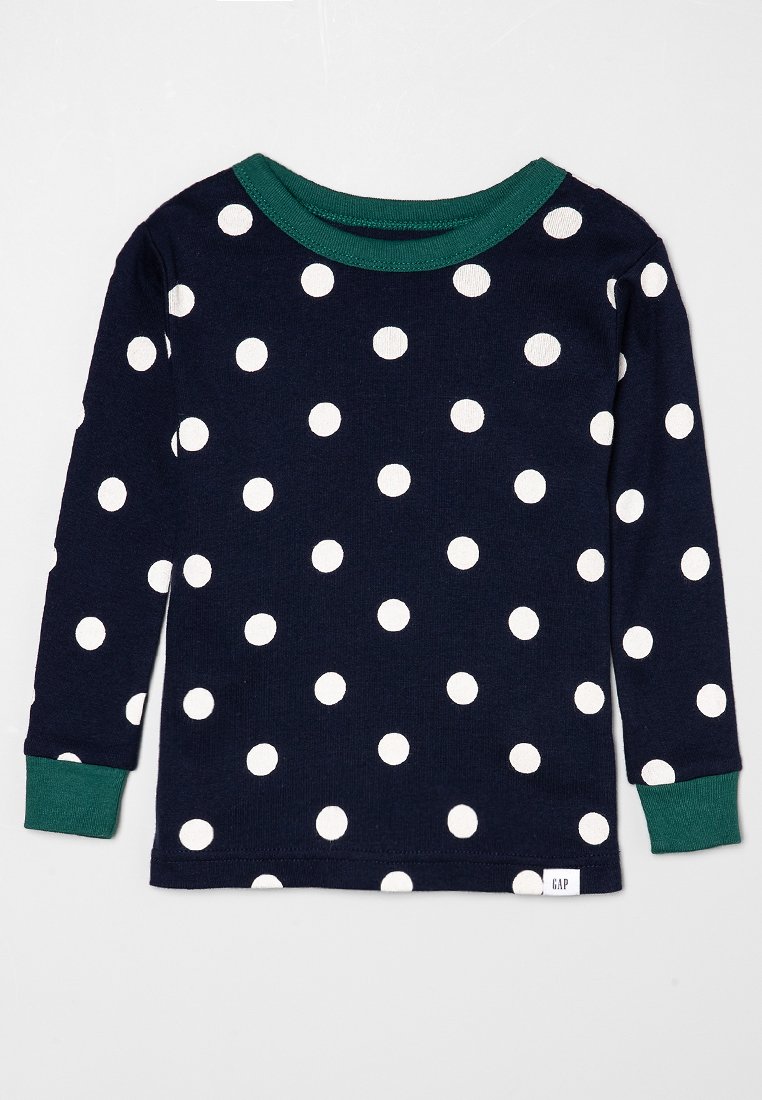 Chemise à manches longues bleu marine avec des pois blancs. Caractérisée par un col et des poignets côtelés verts. Fabriquée en tissu doux. Étiquette de la marque à l'ourlet.