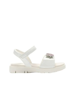 Sandalo bianco con punta aperta, cinturino regolabile alla caviglia e decorazione floreale rosa con strass sulla fascia anteriore, suola piatta.