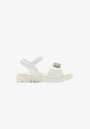 Sandalo bianco con punta aperta, cinturino regolabile alla caviglia e decorazione floreale rosa con strass sulla fascia anteriore, suola piatta.
