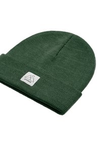 Dark green ribbed knit beanie with folded cuff featuring a small white square patch labeled "protest" and a geometric logo.