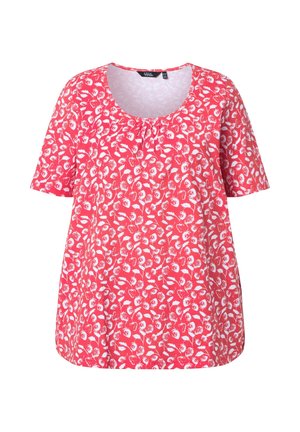 Punainen lyhythihainen pusero, jossa valkoinen kukkakuvio ja pyöreä pääntie, jossa pieni kerätty yksityiskohta kauluksen alla.