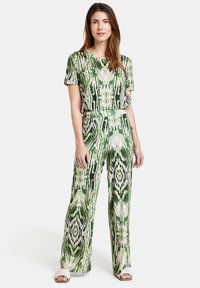 Gerry Weber GEMUSTERTE JERS - Trousers - ecru weiss grün druck